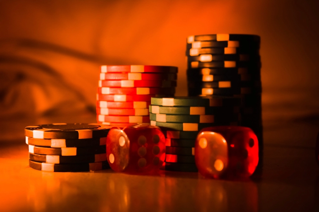 Stacks of casino chips and dice