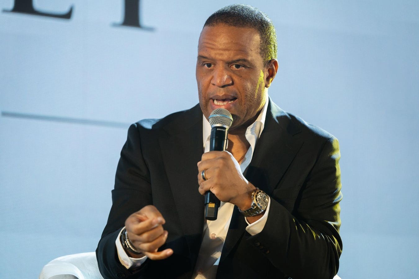 John Hope Bryant speaking on stage