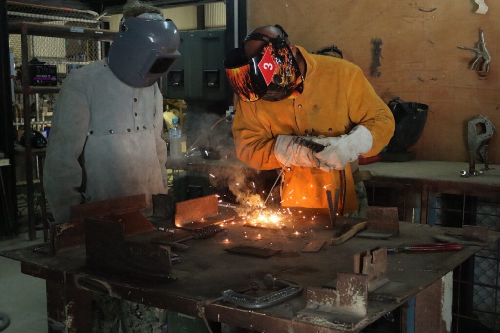 A student learning to weld